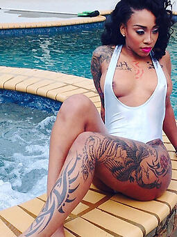 hot tattooed swart stripping