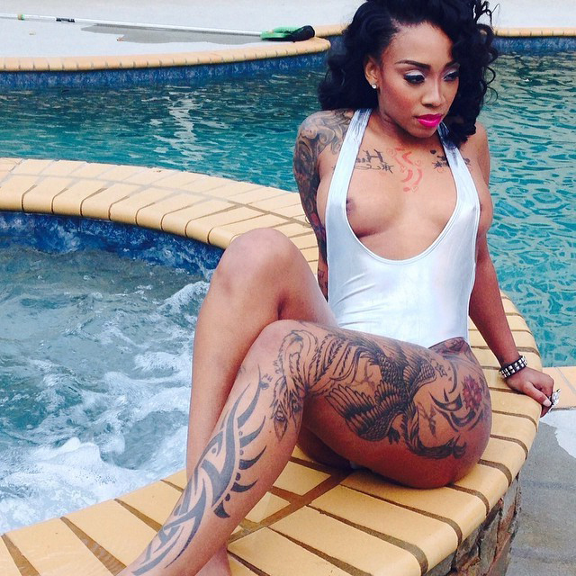 hot tattooed swart stripping